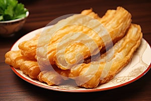 Youtiao on a plate with parsley