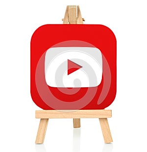 Youtube icon printed on paper and placed on wooden easel