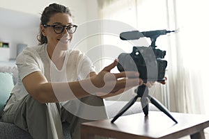 Youtuber recording a video in the living room photo