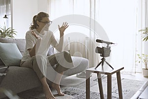 Youtuber recording a video in the living room photo