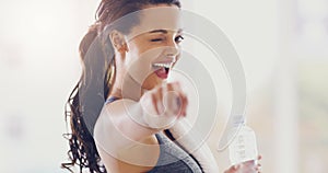 Youve got this. Cropped portrait of an attractive young woman pointing towards the camera during her workout at home.