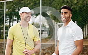 Youve got this. a handsome young male tennis player standing outside on the court with his coach.