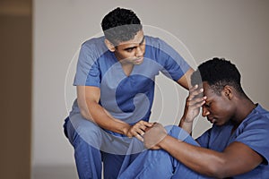 Youve got so much support. a young male doctor consoling a coworker at work.