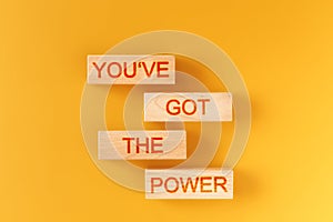 Youve got the power. wooden blocks saying youve got the power on an orange background.