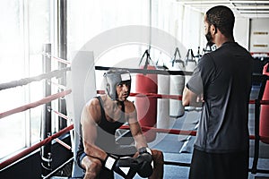 Youve got to play to your strengths. a man training in the boxing ring with a coach.