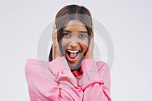 Youve made my day. Studio portrait of an attractive young woman looking surprised against a grey background.