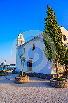 Ypapanti Church - Beautiful scenery at sunset in Gouvia Bay Ã¢â¬â small ancient white church on a pier, Corfu island, Ionian sea,