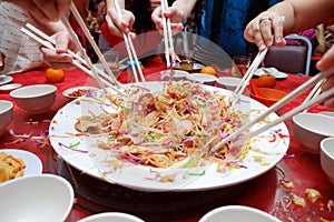 Yu Sheng Spring Toss also known by 2015 Yee Sang Prosperity Toss is a Chinese New Year Dish photo