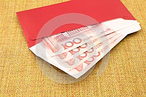 Yuan banknote and red envelope