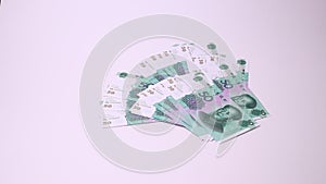 Yuan Chinese currency isolated on a white background. Studio footage, non edited.