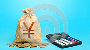 Yuan Yen money bag and calculator. Accounting concept. Analysis of loan selection. Income and expenses. Budgeting. Calculation