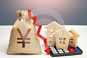 Yuan Yen money bag with down arrow and houses on calculator. Saving resources and reducing maintaining cost, energy efficiency.