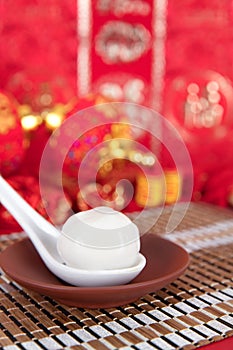 Yuanxiao or Tangyuan food in the Lantern Festival. The Chinese characters in the picture mean `happiness`