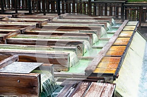 Yubatake hot spring wooden boxes with mineral water