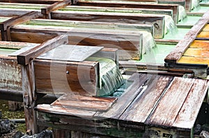 Yubatake onsen, hot spring wooden boxes with mineral water