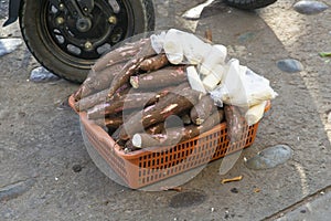 Yuca from an organic plantation in a bucket at a Tarapoto market in the Peruvian jungle.