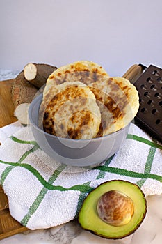 Yucca bread with avocado on Wood background