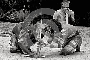 Yugambeh Aboriginal warriors men demonstrate fire making craft photo