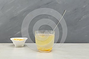 Yuja-cha or yuja tea is a traditional Korean citron tea made by mixing hot water with yuja-cheong yuja marmalade. Close-up,