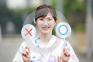 Yukata woman with a circle and a cross tag