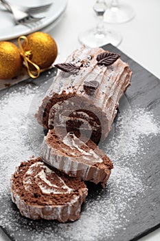 Yule log cake on a Christmas table