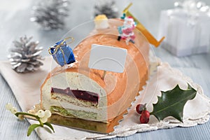 Yule log of white chocolate mousse, stuffed with raspberry puree