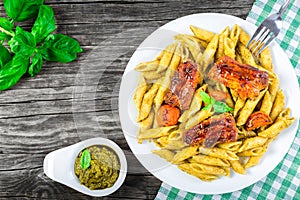 Yummi pasta penne with grilled ribs, view from above photo