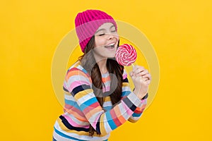 yummy. happy teen girl singer hold lollipop. lollipop lady. hipster kid with colorful lollypop