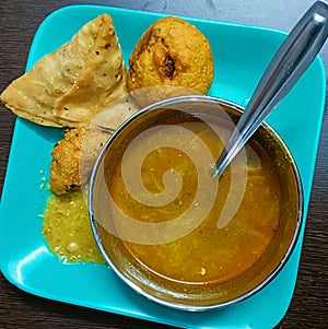 Yummy Odia style Vada, Aloo Chop and Samosa served hot alongside peas curry and chutney in evening snacks