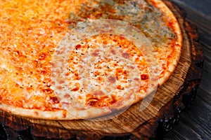 Yummy pizza with appetizing crust close up. Quattro formaggi che