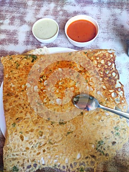 Yummy tastey rava dosa with coconut chutney and tomato chutney and south Indian sambhar