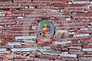 Mani stones with buddhist mantra Om Mani Padme Hum engraved in Tibetan in Yushu, China