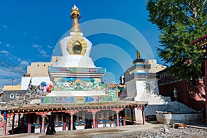 Tibetan pilgrims circle the Pagoda in YUSHU (JYEKUNDO),  CHINA.