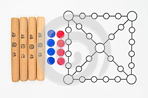 Yutnori is a traditional Korean board game that uses four wooden sticks called yut.