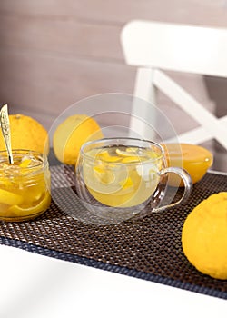 Yuzu tea made from yuzu jam and honey. Yuja-chhong is a marmalade made from yuzu zest, juice and honey photo