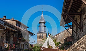 The Saint Pancrace church and its magnificent bell tower, in the medieval village of Yvoire photo