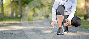 Yyoung fitness woman legs walking in the park outdoor