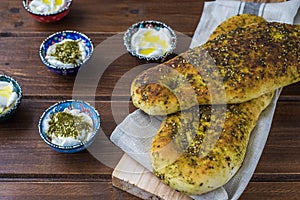 Za`atar bread, a lebanese or turkish or arabic bread made with sumac, sesame  seeds  olive oil served with labneh or labane on top