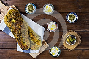 Za`atar bread, a lebanese or turkish or arabic bread made with sumac, sesame  seeds  olive oil served with labneh or labane on top