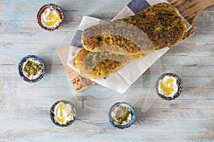 Za`atar bread, a lebanese or turkish or arabic bread made with sumac, sesame  seeds  olive oil served with labneh or labane on top