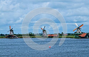 Zaanse Schans, Holland, August 2019. Northeast Amsterdam is a small community located on the Zaan River. View of the mills on the