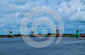 Zaanse Schans, Holland, August 2019. Northeast Amsterdam is a small community located on the Zaan River. View of the mills on the