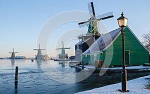 Zaanse Schans Netherlands a Dutch windmill village during sunset whit wooden house holland