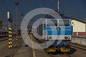 Zabreh station with passenger and cargo trains in sunny day