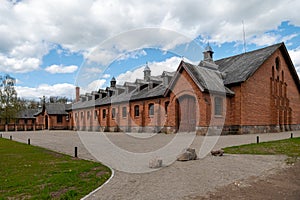 Zagare manor red brick stables on a sunny spring day, Lithuania