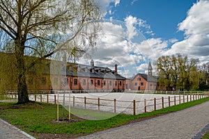 Zagare manor red brick stables on a sunny spring day, Lithuania photo