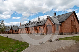 Zagare manor red brick stables on a sunny spring day, Lithuania photo