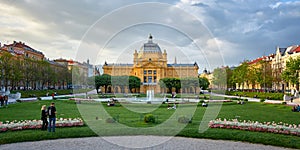 Zagreb, Croatia, April 24, 2019: People enjoying in nice spring day in park Art pavilion in colorful park