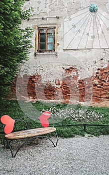 Zagreb / Croatia - May 2019: Creative natural setting for love story couple photography in Zagreb. Romantic heart shaped bench in