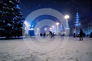 Zagreb main square at night with christmas trees during snowing, Croatia